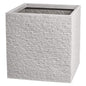 Modern square stone planter with textured brick design, ideal for home décor or garden use
