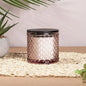 Textured glass candle jar with black lid on woven mat, home decor gift idea