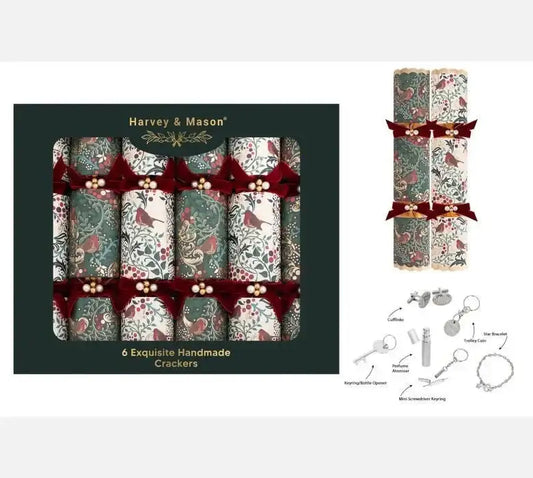 Box of six handmade Christmas crackers with red bird and floral patterns, velvet bows, and small gift assortment.