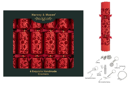 Box of six red handmade Christmas crackers with bows, assorted small gifts shown