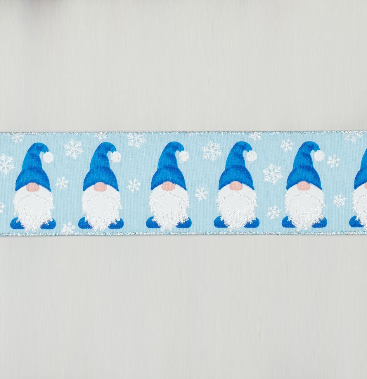 Discover the Blue Repeating Gonk Christmas Ribbon at Bristow Direct