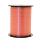 Coral satin ribbon spool for gift wrapping and home décor accents