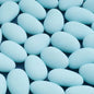 Scattered light blue candy-coated almonds for celebrations or wedding favors