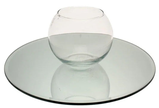 Clear glass bowl centerpiece on round glass mirror plate, modern home decor