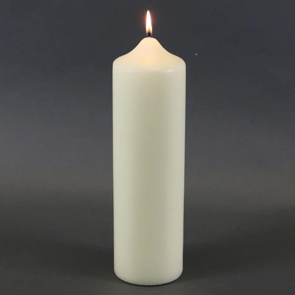Lit white pillar candle for home décor and celebrations