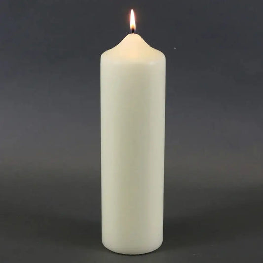 Lit white pillar candle for home décor and celebrations
