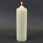 Lit white pillar candle for home décor and celebrations