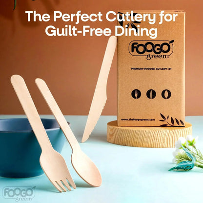 Eco-friendly wooden cutlery set with knife, fork, and spoon beside blue bowl and box.