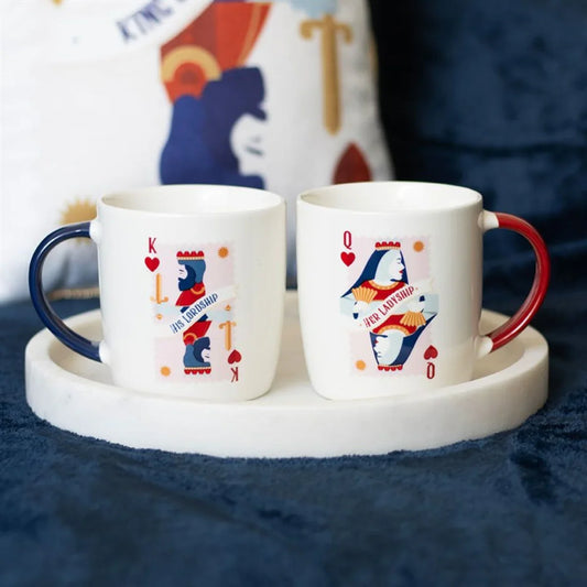 King and Queen of Hearts themed couple mugs with blue and red handles on a tray